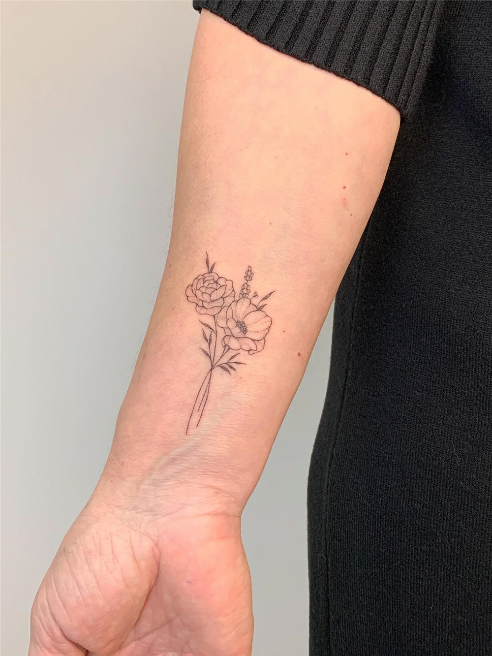 Delicate Floral Tattoo on Wrist for Women