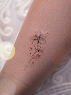 Delicate and Minimalist Floral Tattoo